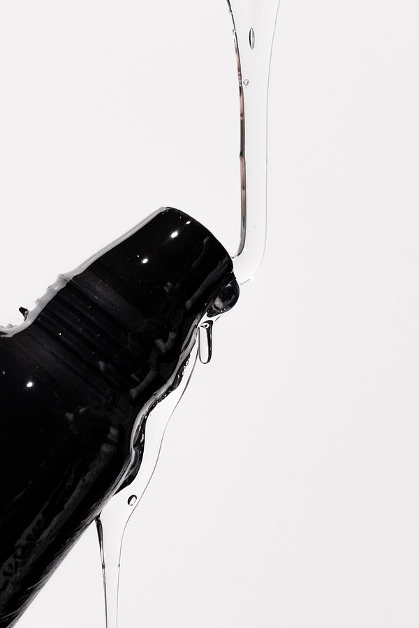 LipLok clear gloss product with glossy drip for The Gloss Era homepage hero